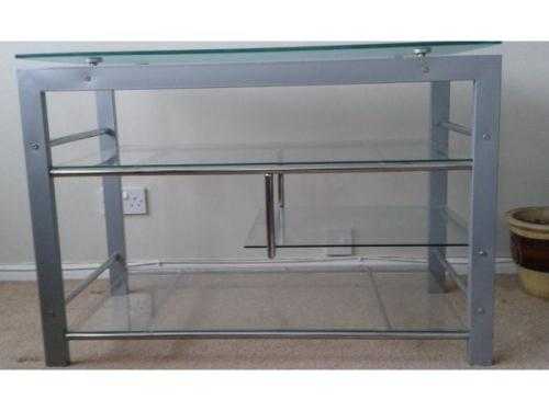 Beautiful Stylish, sturdy, solid, strong Glass and silver TV stand with storage shelves