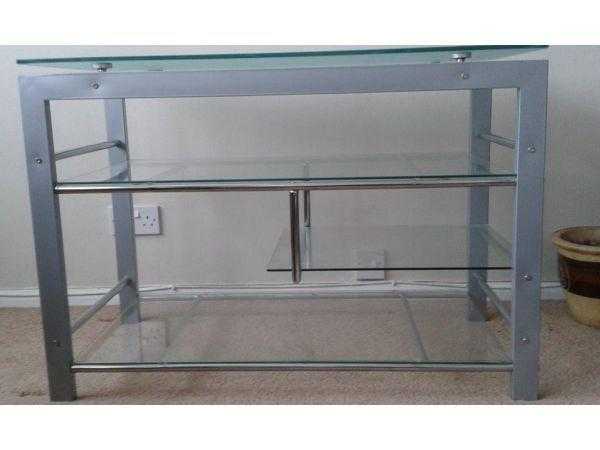 Beautiful Stylish, sturdy, solid, strong Glass and silver TV stand with storage shelves.