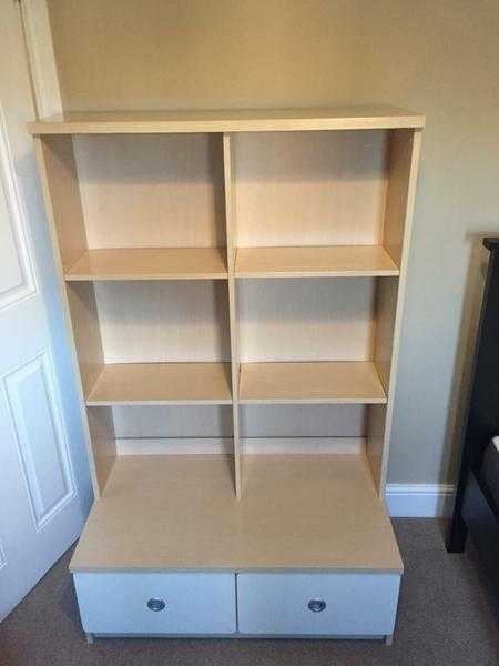 Bedroom shelving unit with drawers.