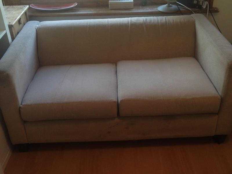 Beige 2 seater sofa