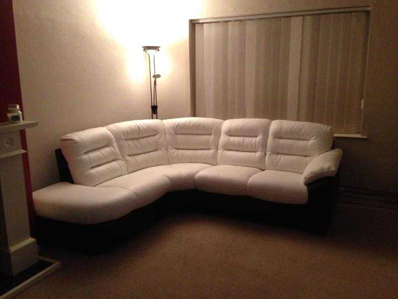 Black amp white leather sofa, electric recliner chair, swivel chair and pouffe in great condition