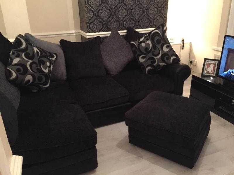 Black and grey fabric corner suite and foot puffy