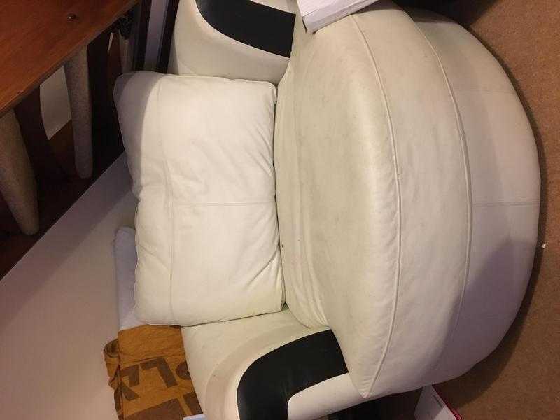 Black and white leather swivel arm chair