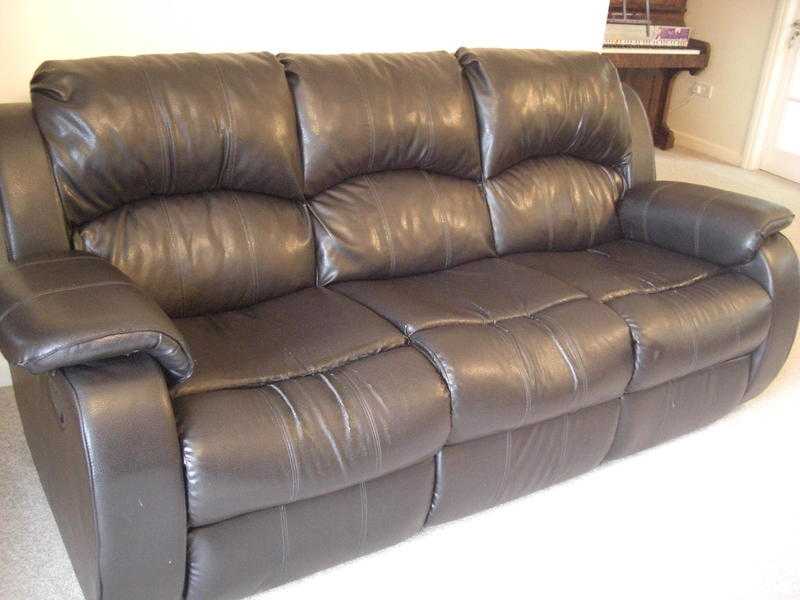 Black comfortable reclining three seater sofa