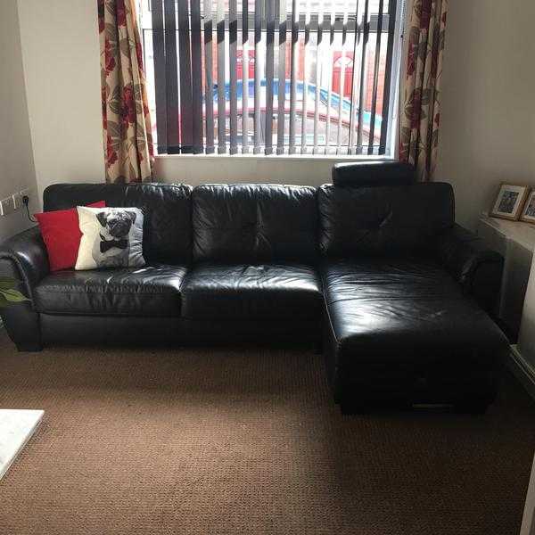 Black DFS Chaise lounge sofa with pull out double bed and storage.  ONO