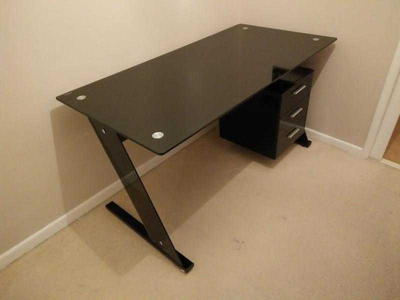 Black glass-topped desk with drawers