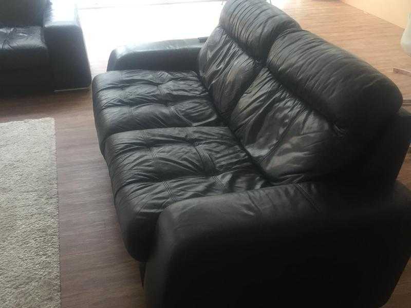 Black leather sofa and armchair