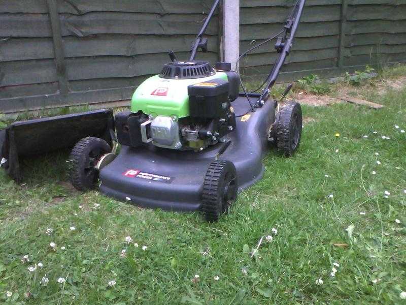 Black petrol lawnmower