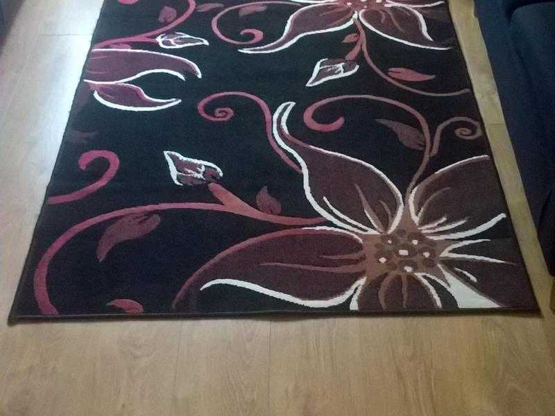 Black red and white patterned rug.