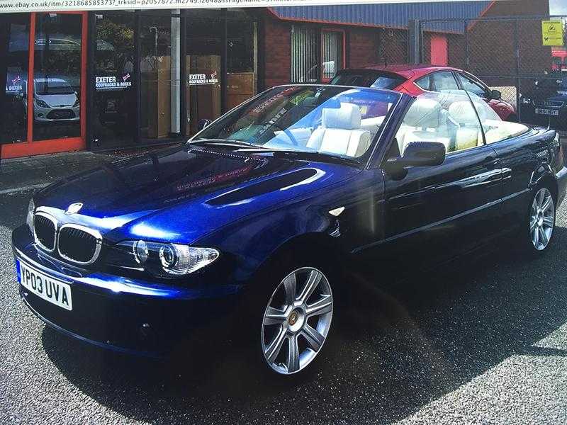 BMW 320i convertible dark met blue 2003