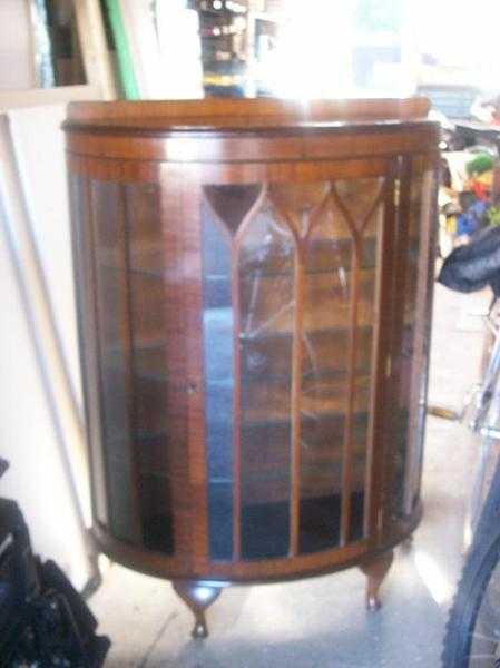 Bow fronted glass cabinet