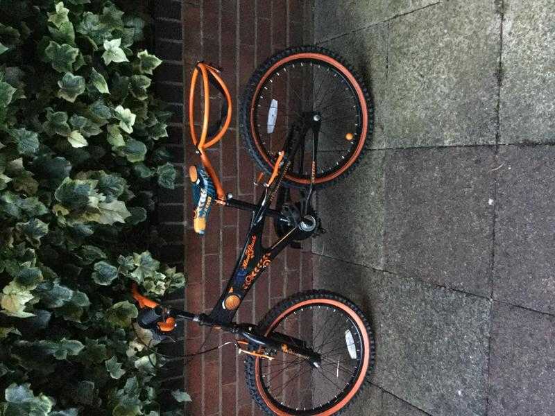 Boys bike . 20quot wheels. Black amp orange with ball holder on back. VGC