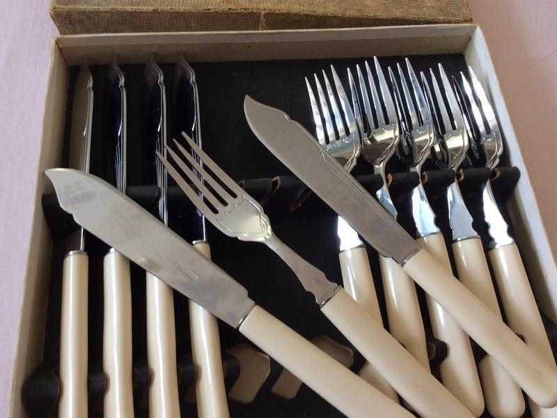 Brand new box of stainless fish knifes and forks
