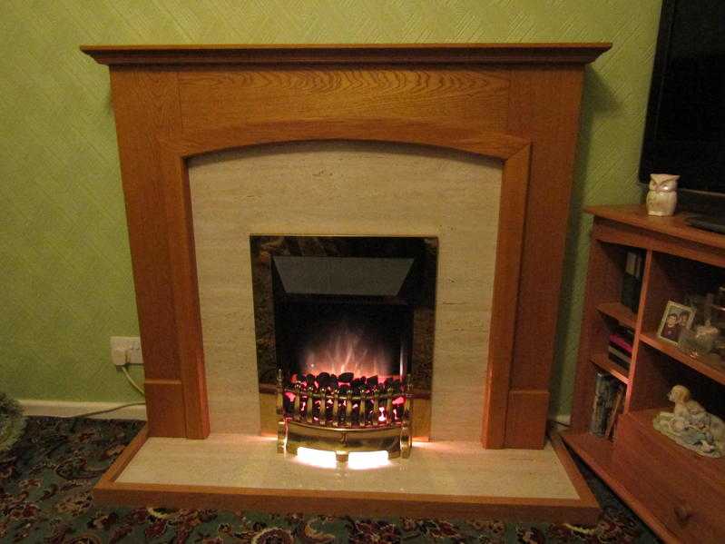 Brass effect electric fire with real coal