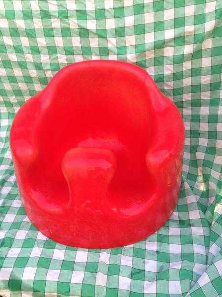 Bright red Bumbo seat