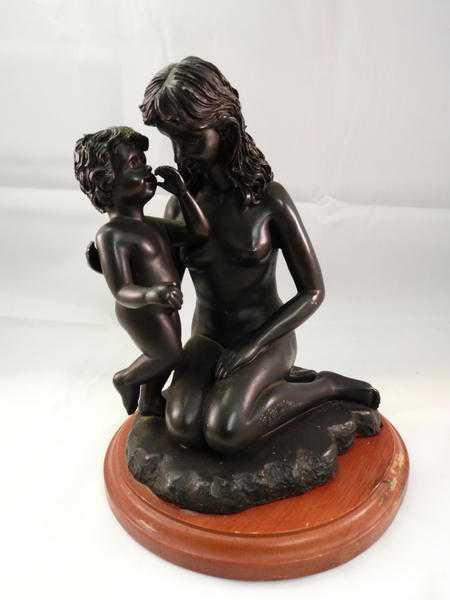 bronzed nude woman and son