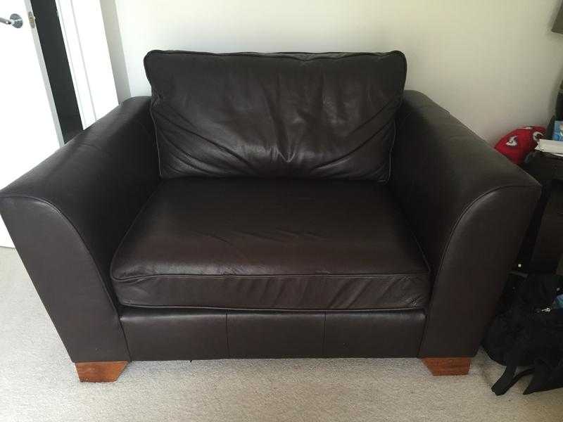 Brown leather love seat