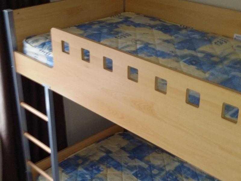 Bunk beds with trundle, making 3rd bed underneath, including 3 single mattresses