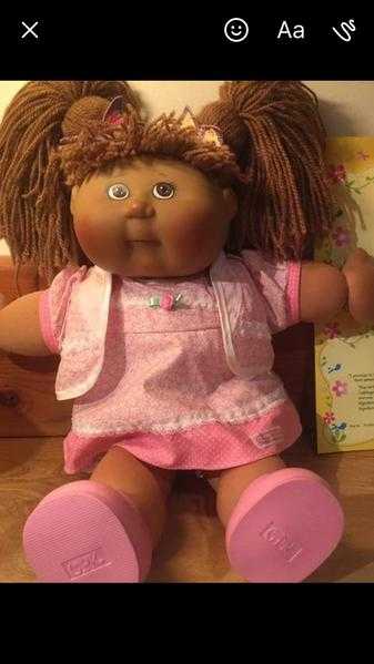 Cabbage patch kid with certificates