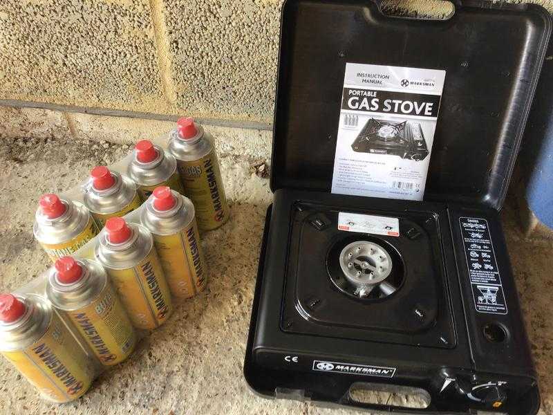 Camping stove and 8 gass bottles