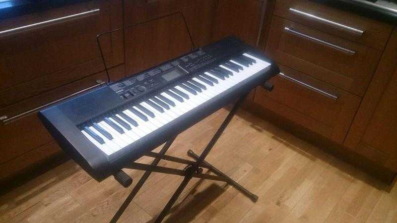 Casio electric keyboard and stand with song book and original boxes