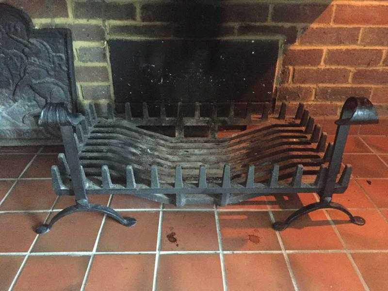 Cast iron firebasket on two fire dogs