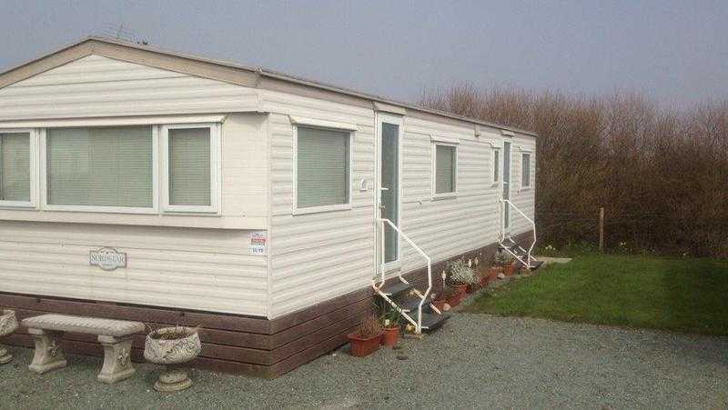 Cheap static caravan for sale ar Sandy Bay, 12month season, low site fees, direct beach access