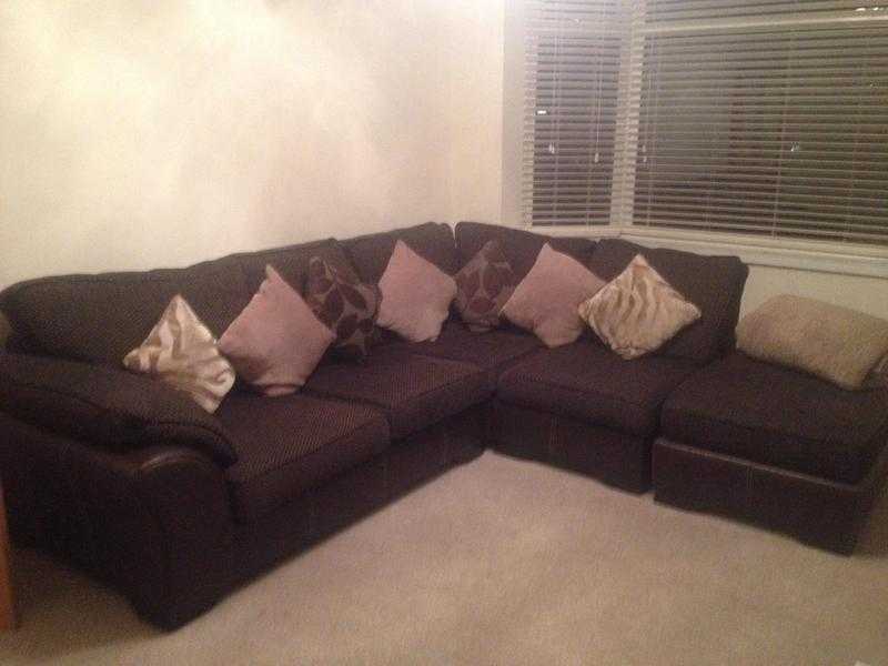 Chocolate brown corner sofa with puff