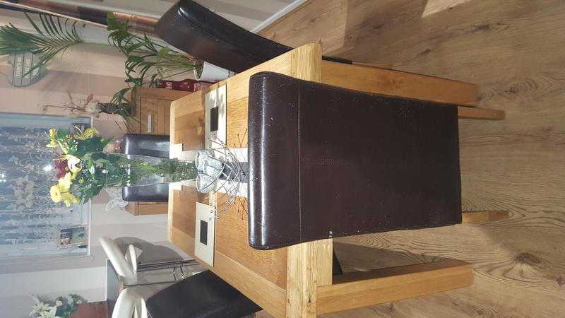 Chocolate brown leather like chairs