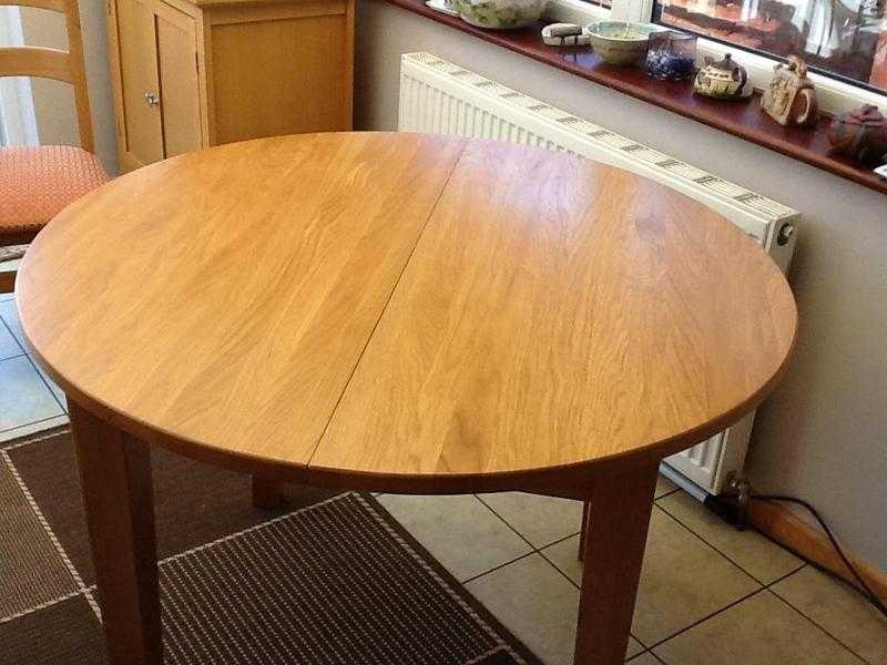 Circular dining table