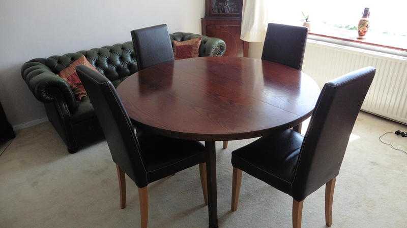 Circular Dining Table  Extends to seat 12.