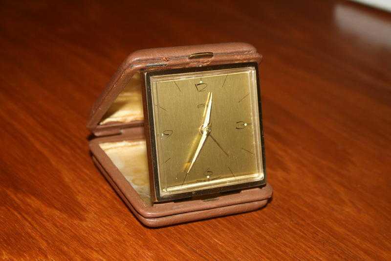 Collectible EMES Brass Travelling Alarm Clock in leather carry case.