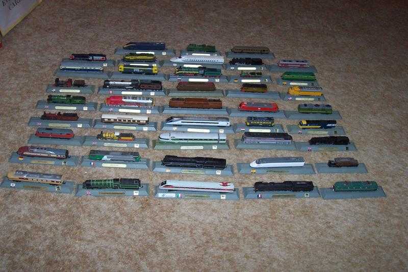 Collection of 43 N Gauge static trains on rail stands