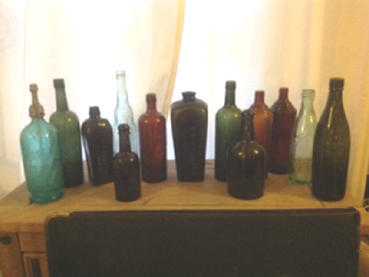 COLLECTION OF GLASS BOTTLES