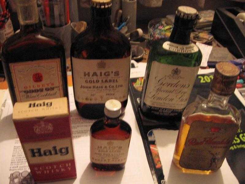 Collection of old bottles, some with contents