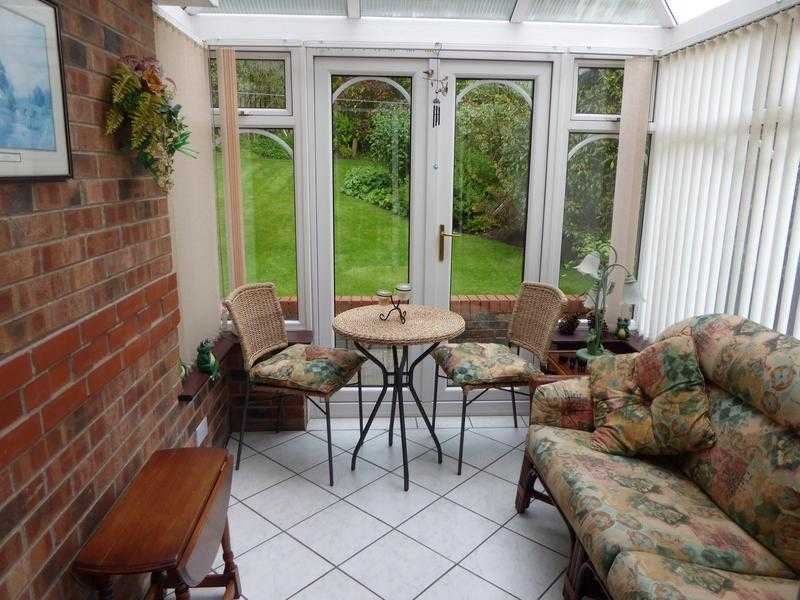 Conservatory sofa and bistro table with two chairs