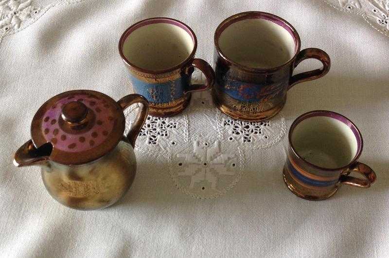 Copper  lustre jug and 3 odd cups