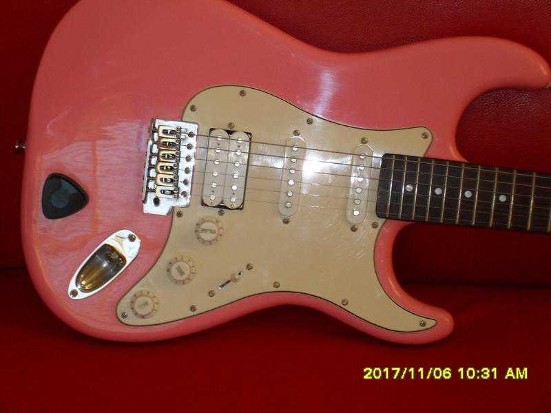 CRAFTER ELECTRIC GUITAR.  A Cruiser Strat style ST200 in immaculate Pink and great order throughout