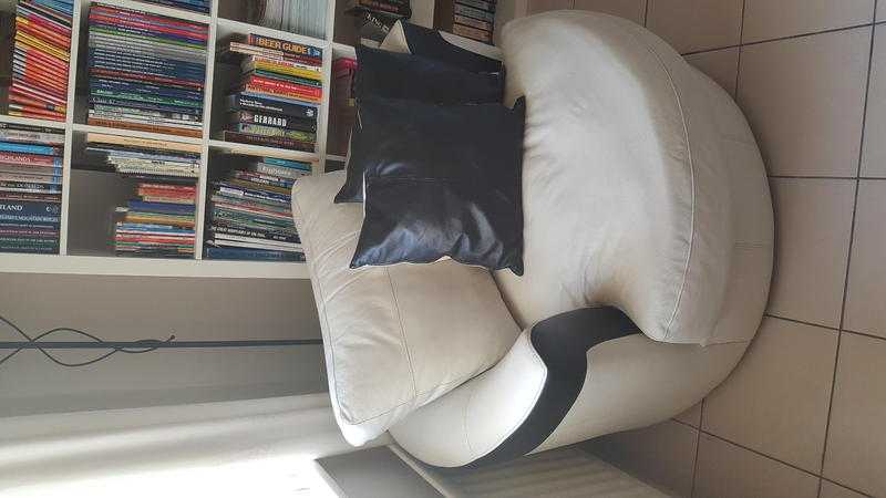 Cream and black leather swivel chair