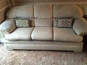 Cream large corner sofa with matching foot stool.