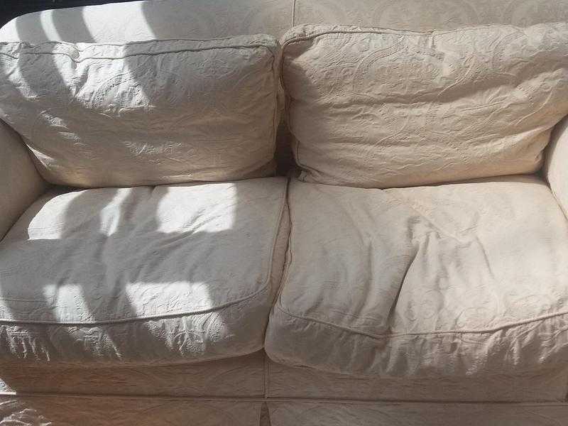 Cream two seater sofa