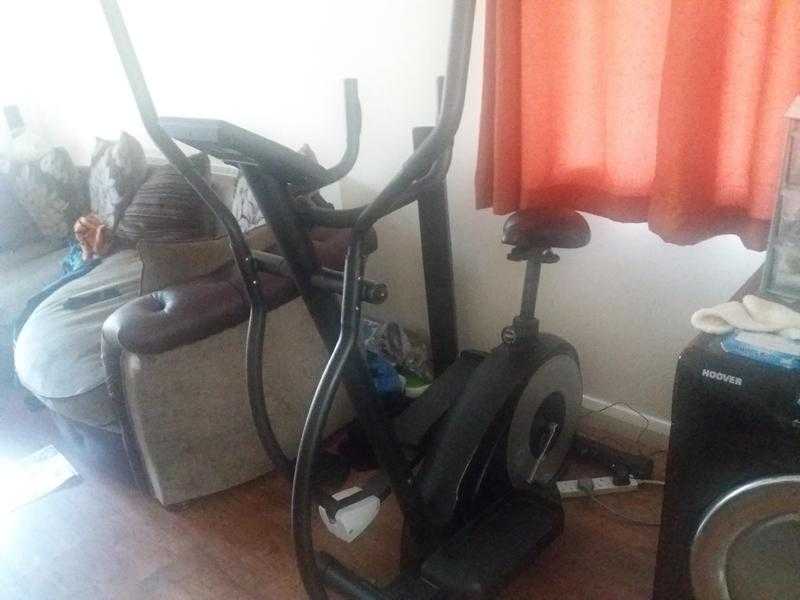 Cross trainer with seat