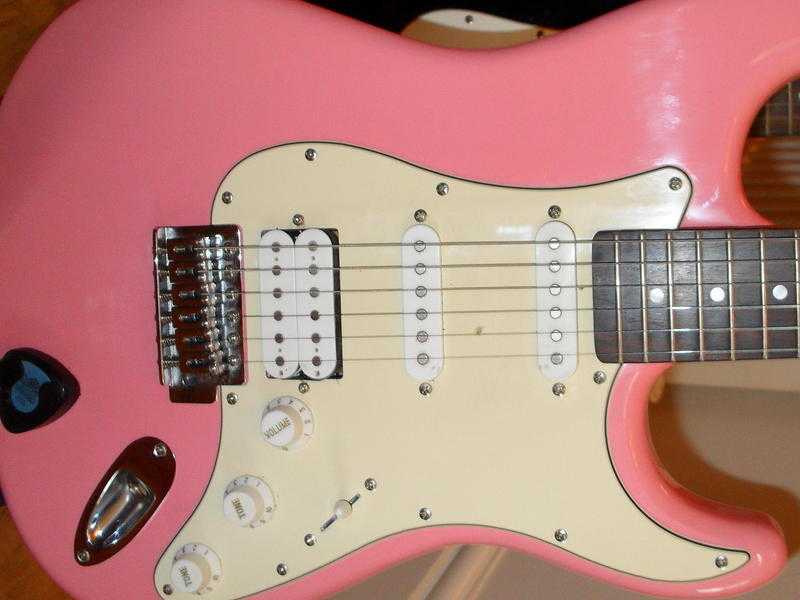 Cruiser PINK electric guitar by CRAFTER. vgc.  Plays and sounds as it should. Excellent  first buy.