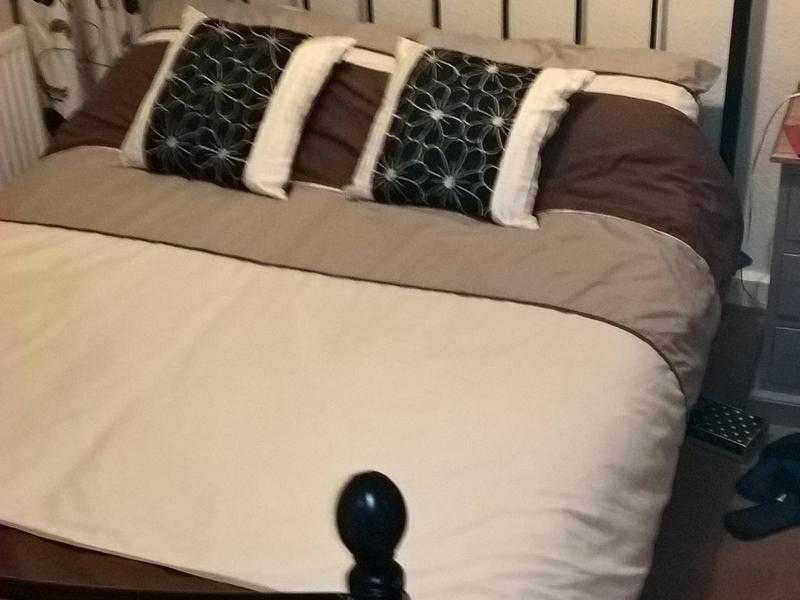 Dark Brown double bed for sale.No mattress. Buyer collects. Westcott.