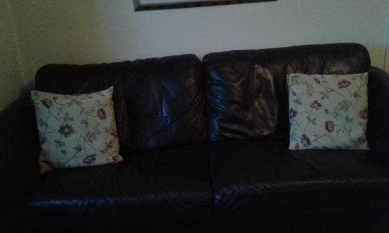 dark brown soft leather three seater sofa and two matching armchairs