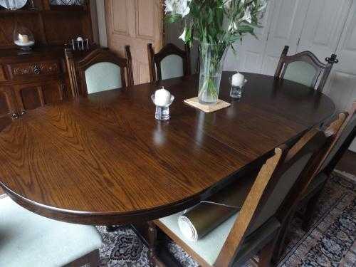 Dark oak dining table, 6 chairs  matching dresser