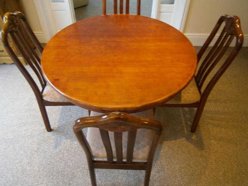 Dark wood dining table and chairs suite