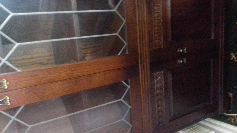 Dark wood glass top dresser