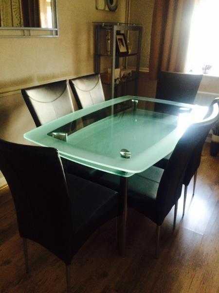 Dining room glass table and 6 chairs