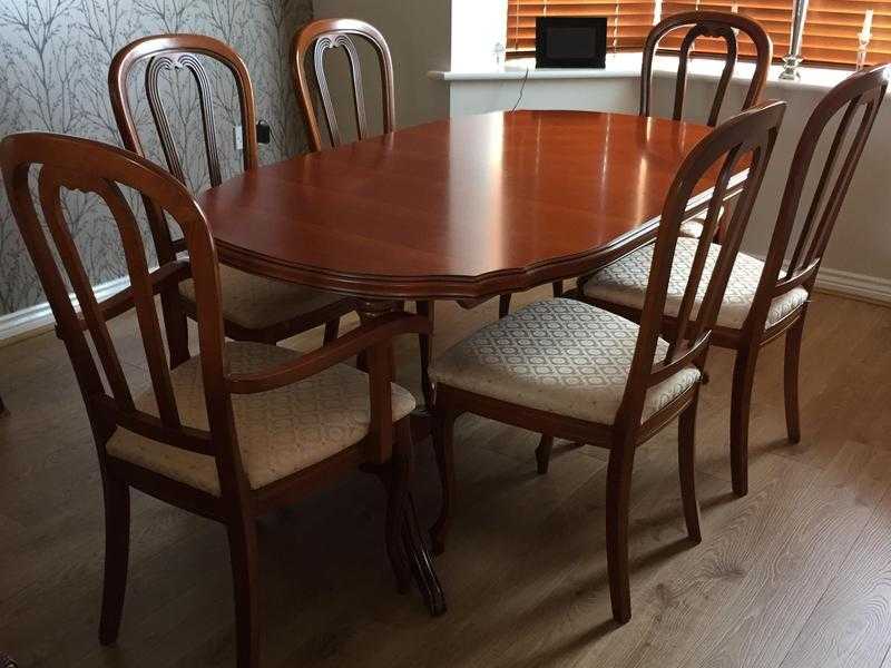 Dining table and 6 chairs - Solid cherry wood finish, extends to seat 8.